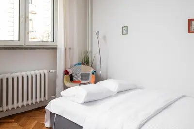 Łóżko lub łóżka w pokoju w obiekcie Elektrownia Powiśle Standard Studio by BookingHost