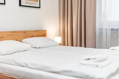 Łóżko lub łóżka w pokoju w obiekcie Lewicka 8 by Homeprime