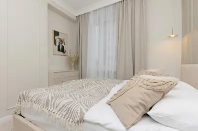 Łóżko lub łóżka w pokoju w obiekcie Bright & Elegant Apartment Warsaw by Noclegi Renters