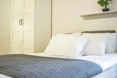 Łóżko lub łóżka w pokoju w obiekcie Przytulne mieszkanie w Centrum