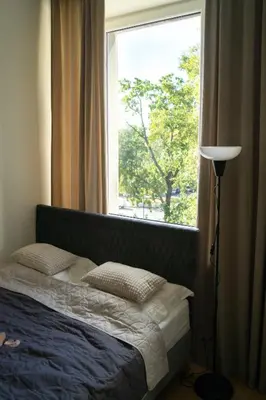 Łóżko lub łóżka w pokoju w obiekcie New! Warsaw Center Boya Apartments