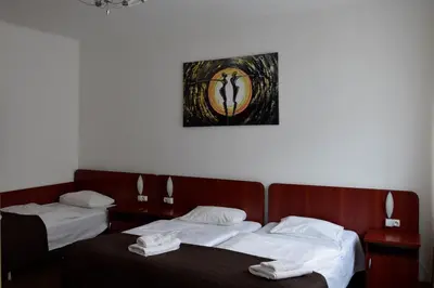 Łóżko lub łóżka w pokoju w obiekcie Villa Victoria