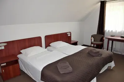 Łóżko lub łóżka w pokoju w obiekcie Villa Victoria
