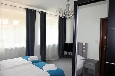 Łóżko lub łóżka w pokoju w obiekcie Villa Victoria