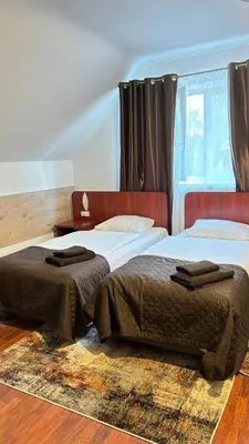 Łóżko lub łóżka w pokoju w obiekcie Villa Victoria