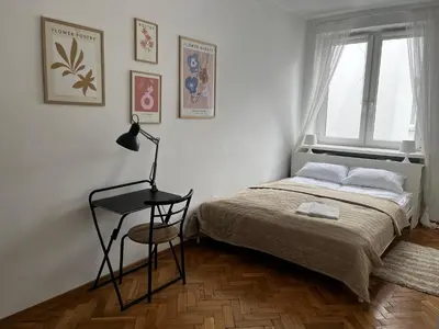 Łóżko lub łóżka w pokoju w obiekcie OhMyHome - Plac Pięciu Rogów - Centrum