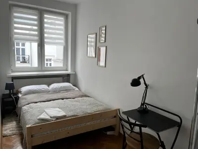 Łóżko lub łóżka w pokoju w obiekcie OhMyHome - Plac Pięciu Rogów - Centrum