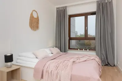 Łóżko lub łóżka w pokoju w obiekcie Cosy Apartments with Parking Wilanów by Noclegi Renters