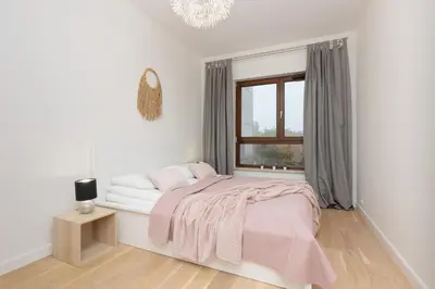 Łóżko lub łóżka w pokoju w obiekcie Cosy Apartments with Parking Wilanów by Noclegi Renters