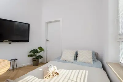 Łóżko lub łóżka w pokoju w obiekcie Wiktoryn 21 Citysphere Premium Suite 2