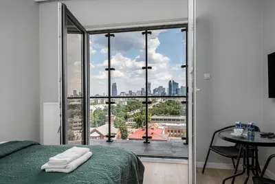 Łóżko lub łóżka w pokoju w obiekcie Warsaw Modern Stay Apartamenty Kasprzaka 29