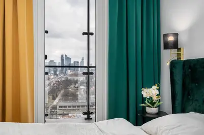 Łóżko lub łóżka w pokoju w obiekcie Warsaw Modern Stay Apartamenty Kasprzaka 29