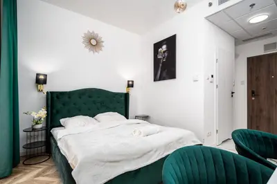 Łóżko lub łóżka w pokoju w obiekcie Warsaw Modern Stay Apartamenty Kasprzaka 29