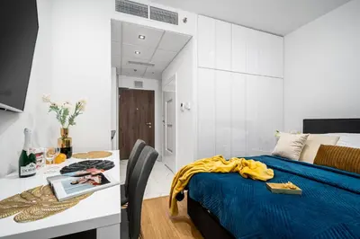 Łóżko lub łóżka w pokoju w obiekcie Warsaw Modern Stay Apartamenty Kasprzaka 29