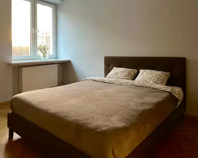 Łóżko lub łóżka w pokoju w obiekcie K22 Andersa 12 m Ratusz Arsenał