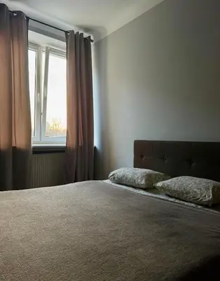 Łóżko lub łóżka w pokoju w obiekcie K22 Andersa 12 m Ratusz Arsenał