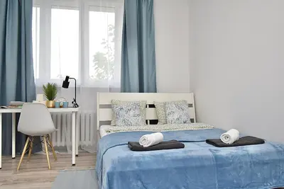 Łóżko lub łóżka w pokoju w obiekcie Rental Apartments Aleja Niepodległości