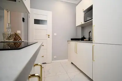 Kuchnia lub aneks kuchenny w obiekcie Rental Apartments Aleja Niepodległości