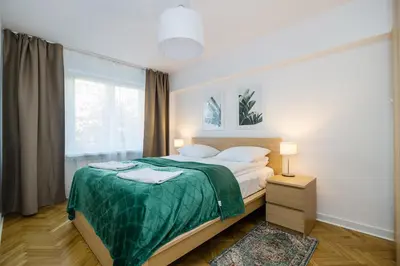 Łóżko lub łóżka w pokoju w obiekcie ShortStayPoland Jana Pawła II (B141)