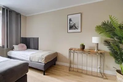 Łóżko lub łóżka w pokoju w obiekcie Privilage Location Apartament w Centrum
