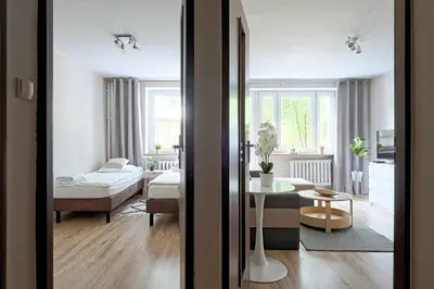 Łóżko lub łóżka w pokoju w obiekcie URBAN NOMAD APARTMENT next to Palace of Culture