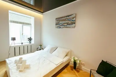 Łóżko lub łóżka w pokoju w obiekcie Wspólna 54a - free Parking - Apartament dla 6 osób - 450 metrów od Dworca Centralnego i Złotych Tarasów - Better Rental