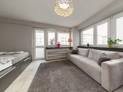 Łóżko lub łóżka w pokoju w obiekcie Studio metro Świetokrzyska