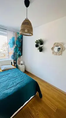 Łóżko lub łóżka w pokoju w obiekcie M&M Apartment Warsaw