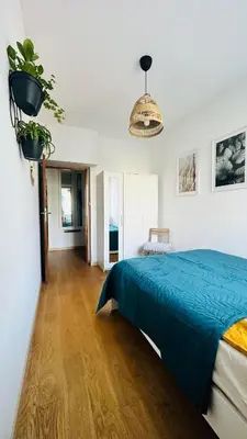 Łóżko lub łóżka w pokoju w obiekcie M&M Apartment Warsaw