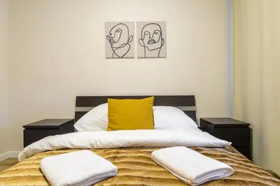 Łóżko lub łóżka w pokoju w obiekcie P&O Apartments Hawajska