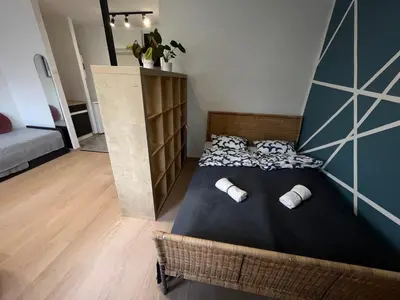 Łóżko lub łóżka w pokoju w obiekcie Murano Apartaments Promenada studio