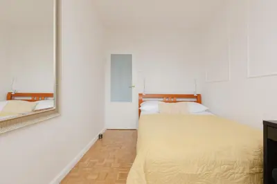 Łóżko lub łóżka w pokoju w obiekcie Warsaw City Center Skylines Apartment by Noclegi Renters
