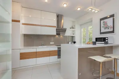 Kuchnia lub aneks kuchenny w obiekcie Cosy Apartment with Parking in the city centre Warszawa by Noclegi Renters