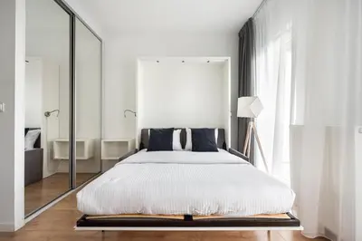 Łóżko lub łóżka w pokoju w obiekcie Varsovia Comfort 625 by BookingHost