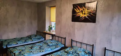 Łóżko lub łóżka w pokoju w obiekcie Zaciszne pokoje