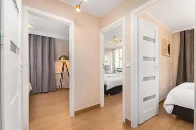 Łóżko lub łóżka w pokoju w obiekcie Apartament Grzybowska Premium by Your Freedom