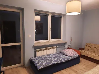Łóżko lub łóżka w pokoju w obiekcie Gościniec filmowy - prywatny dom rodzinny