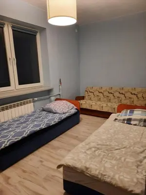 Łóżko lub łóżka w pokoju w obiekcie Gościniec filmowy - prywatny dom rodzinny
