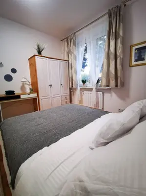Łóżko lub łóżka w pokoju w obiekcie Cosy condo