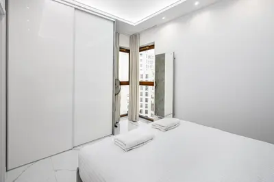 Łóżko lub łóżka w pokoju w obiekcie Bielany Luxury Apartment by BookingHost