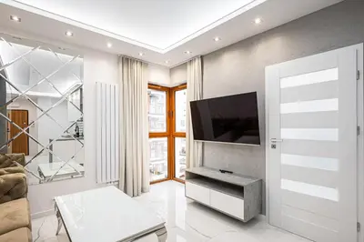 Telewizja i/lub zestaw kina domowego w obiekcie Bielany Luxury Apartment by BookingHost