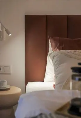Łóżko lub łóżka w pokoju w obiekcie Dubois Cozy Studio near Arkadia