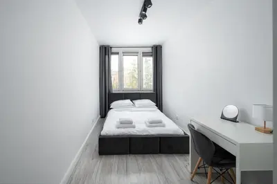 Łóżko lub łóżka w pokoju w obiekcie Wierzbno Modern Apartment by BookingHost