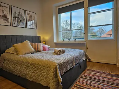 Łóżko lub łóżka w pokoju w obiekcie Apartamenty Park Powiśle