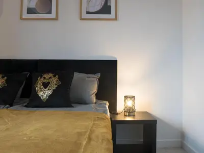 Łóżko lub łóżka w pokoju w obiekcie Apartament Clever 2 Kamienica Grochów