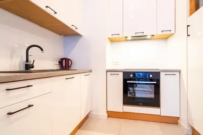 Kuchnia lub aneks kuchenny w obiekcie ApartamentySnu, Wola Premium III z parkingiem