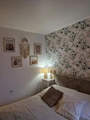 Łóżko lub łóżka w pokoju w obiekcie Vizzit Us Twarda Apartament