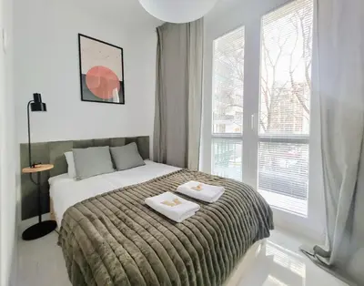 Łóżko lub łóżka w pokoju w obiekcie Warsaw Concierge Hoża Corner