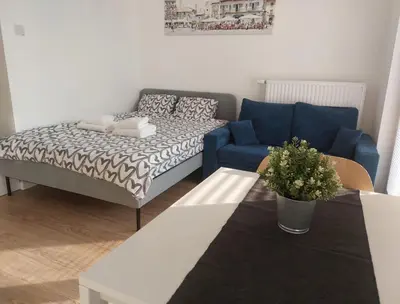 Łóżko lub łóżka w pokoju w obiekcie Życzliwy Apartament z garażem