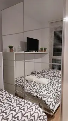 Łóżko lub łóżka w pokoju w obiekcie Życzliwy Apartament z garażem